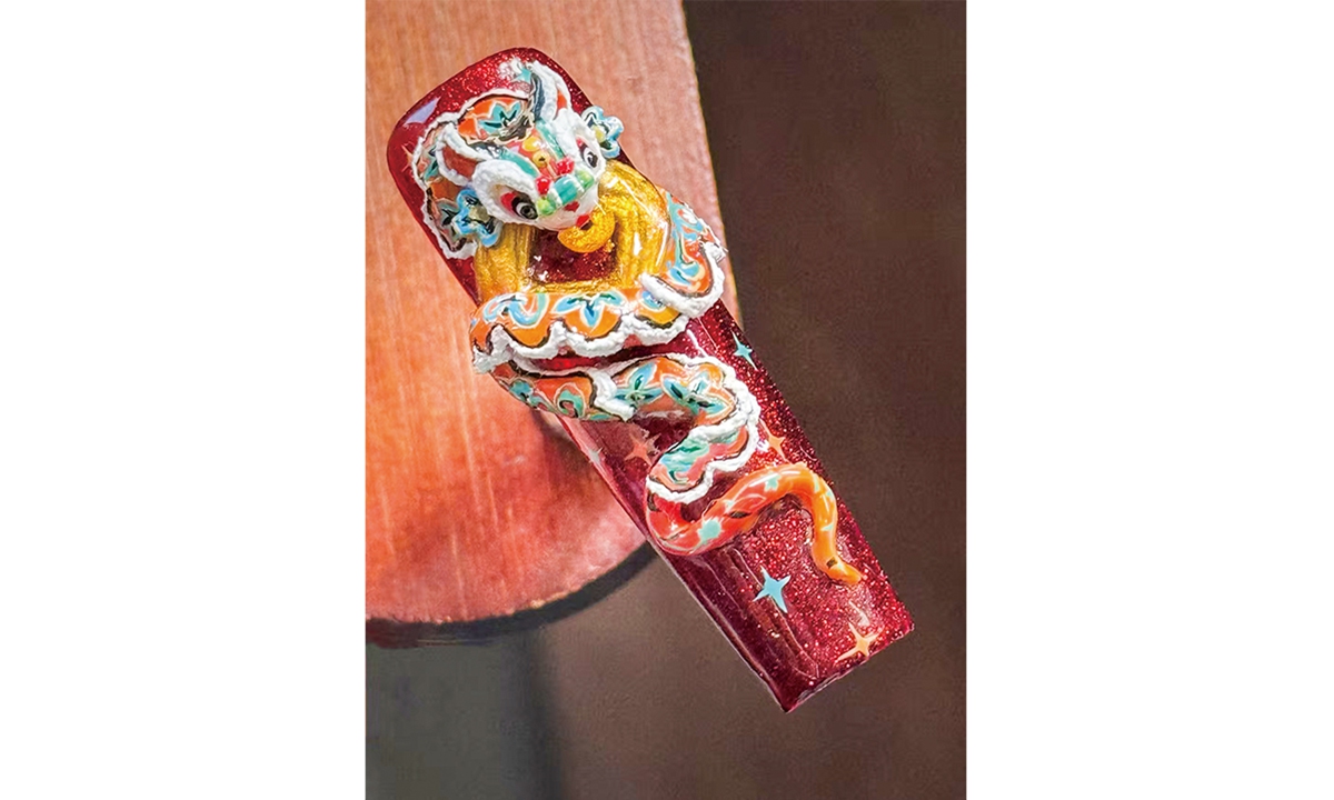 A press-on nail design featuring the image of a Chinese dragon  