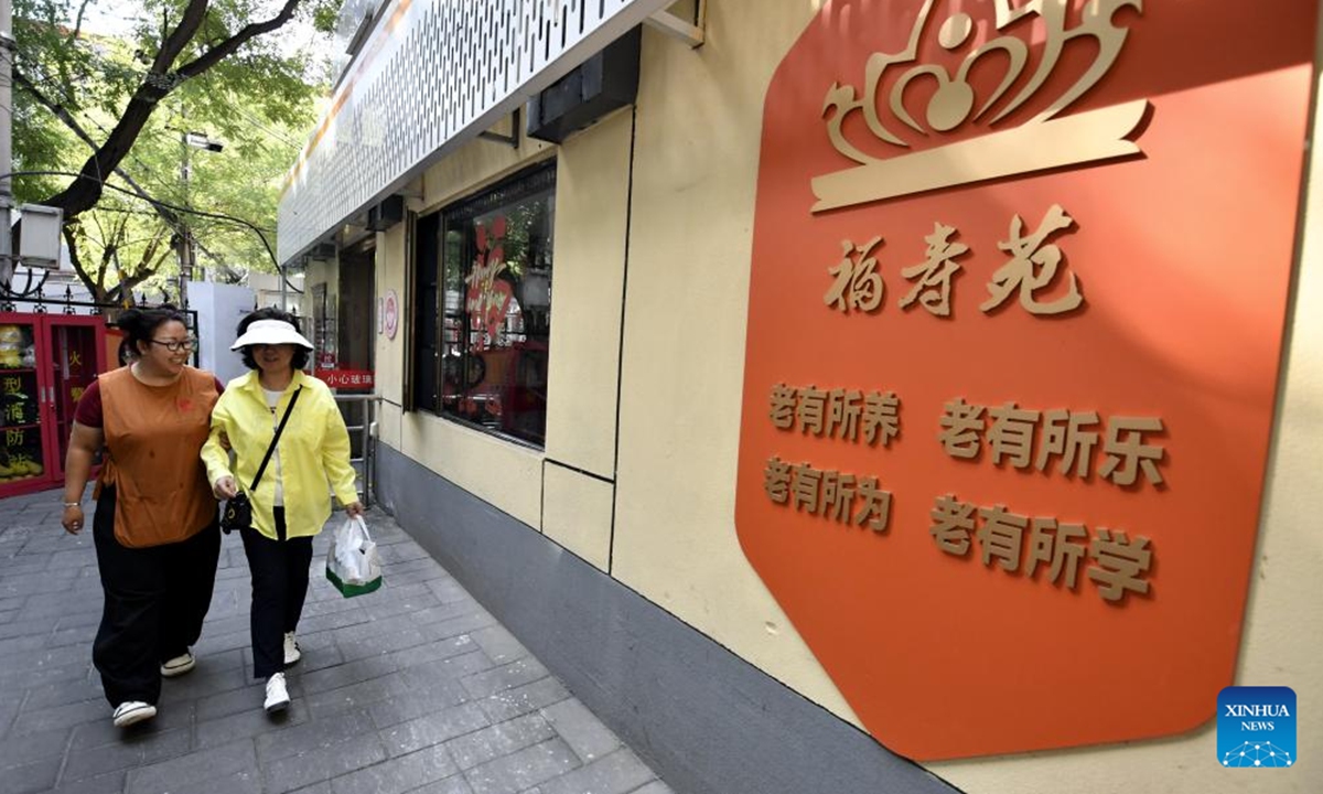 Residents walk to a senior community canteen to buy lunch in Xiangheyuan Neighborhood, Chaoyang District, Beijing, capital of China, Sept. 26, 2025. In recent years, Xiangheyuan Neighborhood of Chaoyang District has been actively developing a senior-friendly meal service network to meet the dietary needs of its elderly residents. The neighborhood has built two central kitchens and seven senior community canteens. Additionally, it has established a special meal delivery system for the elderly jointly with online platforms, ensuring that the elderly residents here can enjoy healthy and delicious meals. (Xinhua/Li Xin)