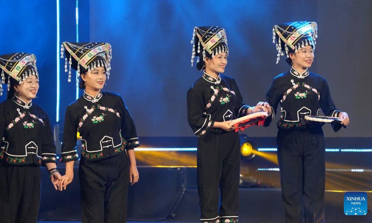 A choir from southwest China's Yunnan Province stages a performance during a China-Vietnam Mid-Autumn Festival Gala in Hanoi, Vietnam, Sept. 25, 2025. The gala was held on Thursday in the Vietnamese capital Hanoi, bringing together artists and performing troupes from the two nations on the same stage to celebrate the approaching festival. (Xinhua/Hu Jiali)