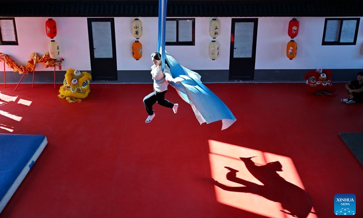 A student practice acrobatic skills at Zhang Shuo's acrobatic courtyard in Sangyuan Town, Wuqiao County, north China's Hebei Province, on Sept. 25, 2025. Wuqiao, dubbed the cradle of Chinese acrobatic art, boasts 14 diverse acrobatic courtyards that serve as a cluster of bases for artist training, new play designing, and folk art research. (Xinhua/Mu Yu)