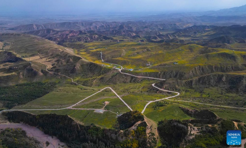 An aerial drone photo taken on Sept. 26, 2025 shows the autumn view around the Mati Temple Grottoes in Zhangye City, northwest China's Gansu Province. First built around 1,600 years ago along the route of the ancient Silk Road, the Mati Temple Grottoes are famous for Buddhist relics preserved in more than 70 caves, including more than 500 colored sculptures as well as murals spanning a total of over 1,200 sq meters. (Xinhua/Zhang Zhimin)