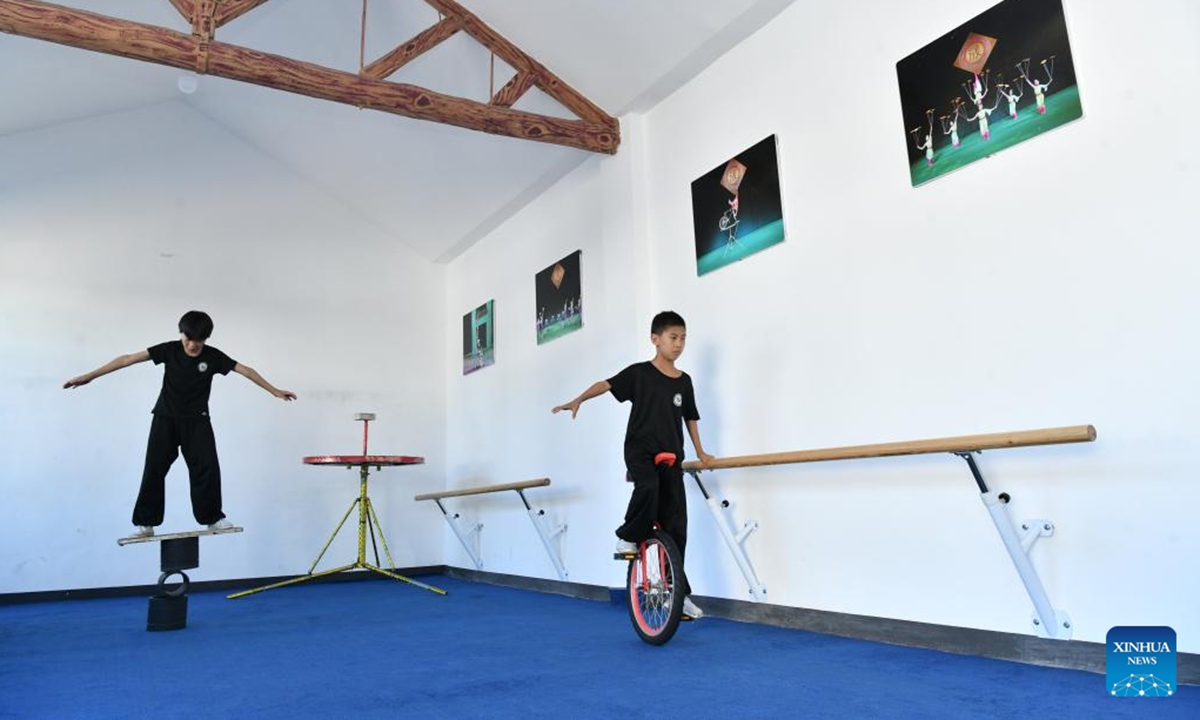 Students practice acrobatic skills at the Diao's Troupe acrobatic courtyard in Sangyuan Town, Wuqiao County, north China's Hebei Province, on Sept. 25, 2025. Wuqiao, dubbed the cradle of Chinese acrobatic art, boasts 14 diverse acrobatic courtyards that serve as a cluster of bases for artist training, new play designing, and folk art research. (Xinhua/Mu Yu)