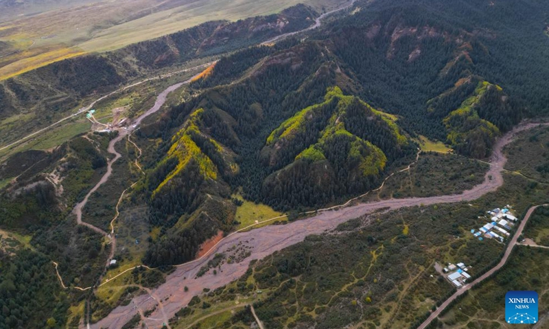 An aerial drone photo taken on Sept. 26, 2025 shows the autumn view around the Mati Temple Grottoes in Zhangye City, northwest China's Gansu Province. First built around 1,600 years ago along the route of the ancient Silk Road, the Mati Temple Grottoes are famous for Buddhist relics preserved in more than 70 caves, including more than 500 colored sculptures as well as murals spanning a total of over 1,200 sq meters. (Xinhua/Zhang Zhimin)

