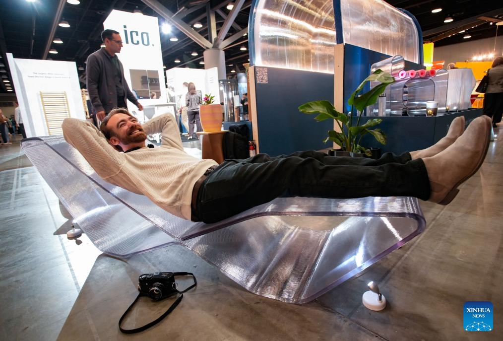A man lies on a 3D-printed chair made with recycled water bottles during the Interior Design Show in Vancouver, British Columbia, Canada, Sept. 26, 2025. The annual show is held here from Sept. 25 to 28. (Photo: Xinhua)