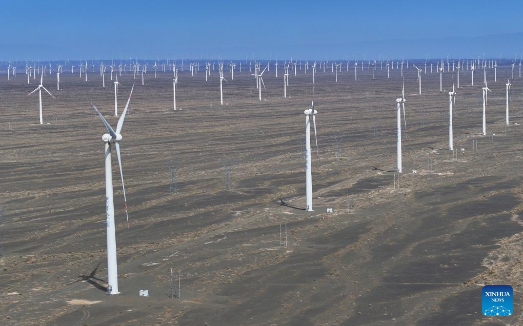 An aerial drone photo taken on April 27, 2025 shows a view of the Santanghu wind power farm in Hami City of northwest China's Xinjiang Uygur Autonomous Region. Xinjiang, a region rich in solar and wind energy resources, has vigorously developed the new energy industry in recent years, accelerating the construction of large-scale wind and photovoltaic power base projects. A 750-kilovolt (kV) power expressway loop, the country's largest of its kind, has taken shape throughout Xinjiang, providing strong support for efficient energy allocation. (Photo: Xinhua)