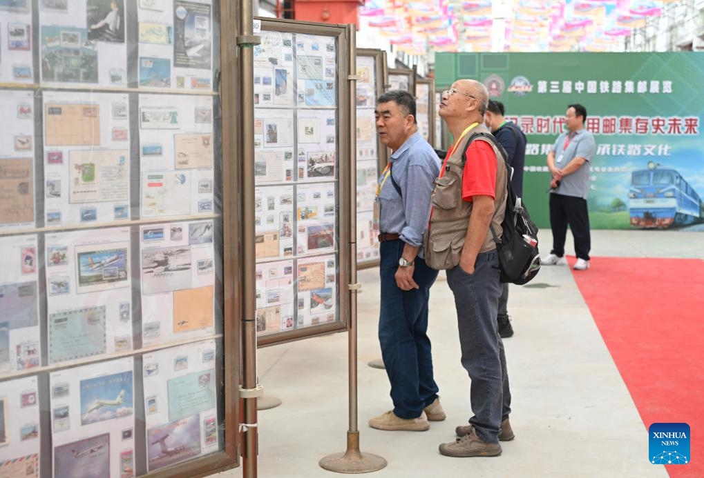 People visit a Chinese railway stamp exhibition during an expo themed on Chinese railway culture in Beijing, capital of China, Sept. 27, 2025. An expo displaying collections of items on Chinese railway culture kicked off here on Saturday, showcasing the development and achievement of Chinese railway. (Photo: Xinhua)