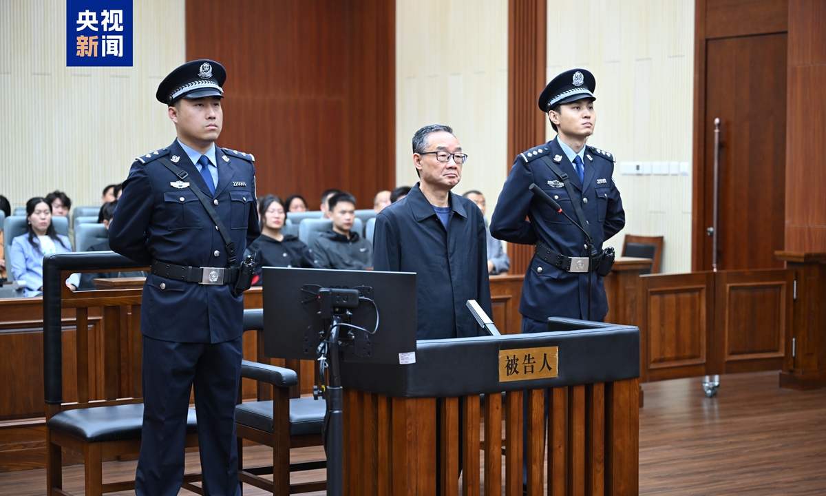 Tang Renjian, former Party chief and minister of the Ministry of Agriculture and Rural Affairs, stands trial at Changchun Intermediate People's Court in Northeast China's Jilin Province. Photo: CCTV News