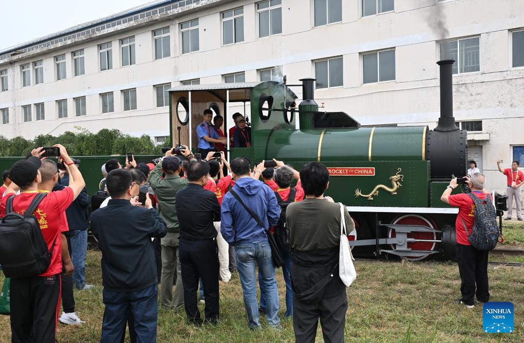 Visitors watch a locomotive sounding the whistle during an expo themed on Chinese railway culture in Beijing, capital of China, Sept. 27, 2025. An expo displaying collections of items on Chinese railway culture kicked off here on Saturday, showcasing the development and achievement of Chinese railway. (Photo: Xinhua)