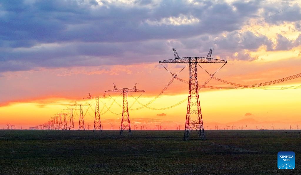 This photo taken on July 5, 2025 shows power lines of the Changji-Guquan ±1100 kV ultra-high voltage direct current power transmission project in the Kazak Autonomous County of Mori, northwest China's Xinjiang Uygur Autonomous Region. Xinjiang, a region rich in solar and wind energy resources, has vigorously developed the new energy industry in recent years, accelerating the construction of large-scale wind and photovoltaic power base projects. (Photo: Xinhua)