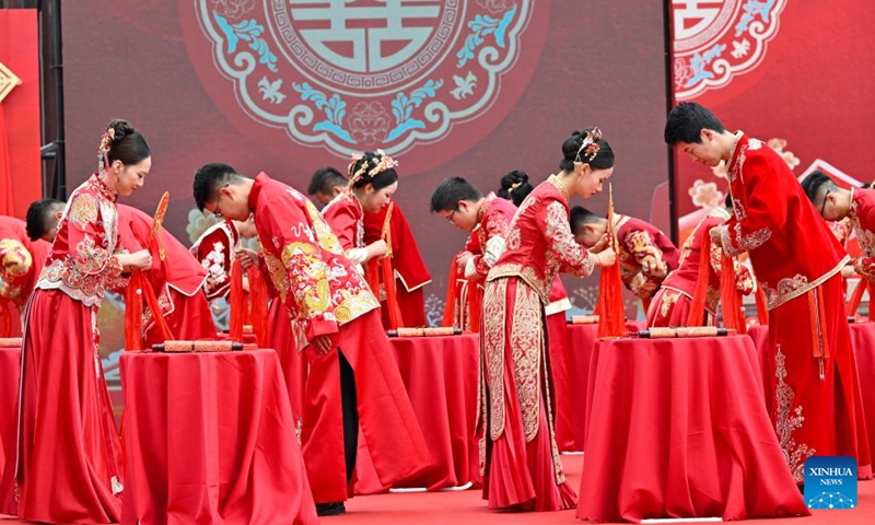 Couples take part in a group wedding in the Luzhi ancient town in Suzhou, east China's Jiangsu Province, Sept. 29, 2025. Photo: Xinhua