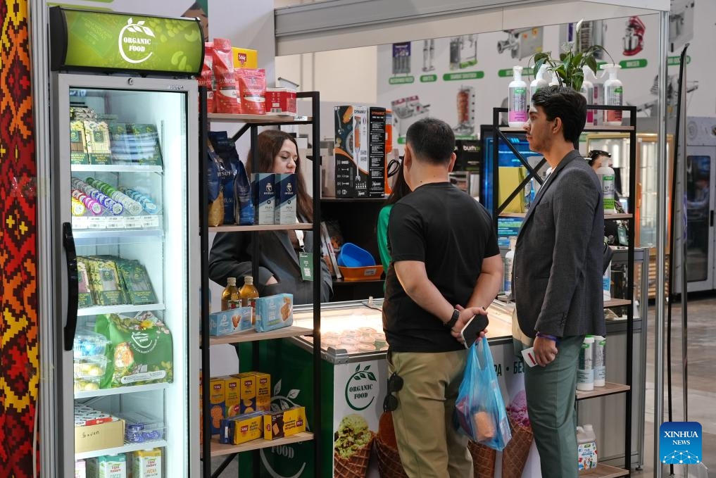 People visit an international exhibition of food, packaging, processing technologies and HoReCa (hotel, restaurant and cafe) industry in Tashkent, the capital of Uzbekistan, on Oct. 4, 2025. The exhibition, held here on Oct. 2-4, brought together companies from various sectors, including food, ingredients and spices, packaging equipment, hygiene and safety, and storage and logistics, aiming to promote technological exchange within the industry and drive the development of the sector in Uzbekistan. (Photo by Zafar Khalilov/Xinhua)