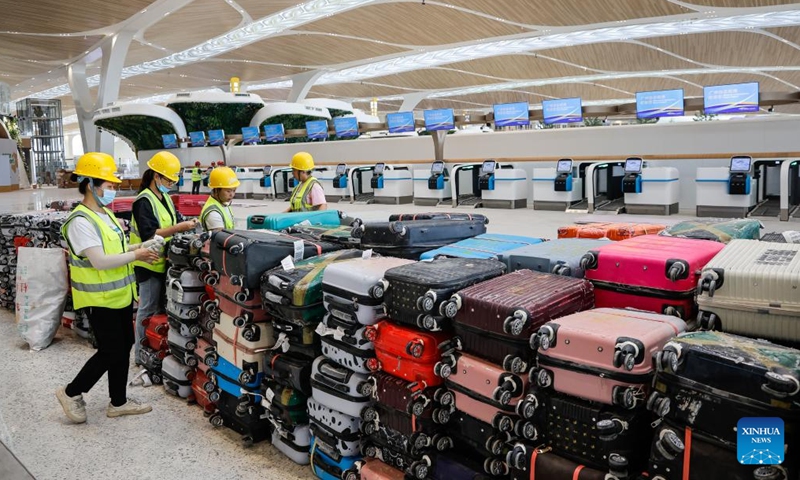 Staff members carry out a check-in luggage test at the departure area of the T3 Terminal of Guangzhou Baiyun International Airport in Guangzhou, south China's Guangdong Province, Sept. 29, 2025. Photo: Xinhua