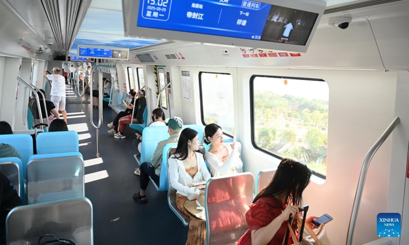 Passengers are pictured aboard an airport-bound train of Fuzhou Metro Binhai Express in Fuzhou, southeast China's Fujian Province, Sept. 29, 2025. With a length of about 62.4 kilometers, Fuzhou Metro Binhai Express became operational on Monday. Photo: Xinhua
