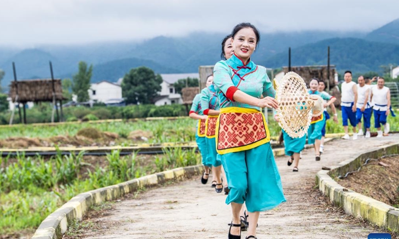 Villagers sing and dance in Jiangjun Village, Bishan District, southwest China's Chongqing Municipality, Sept. 29, 2025. The 5th edition of a rural art fair kicked off here on Monday, as one of the serial celebrations of Chongqing's 2025 Chinese farmers' harvest festival. Photo: Xinhua
