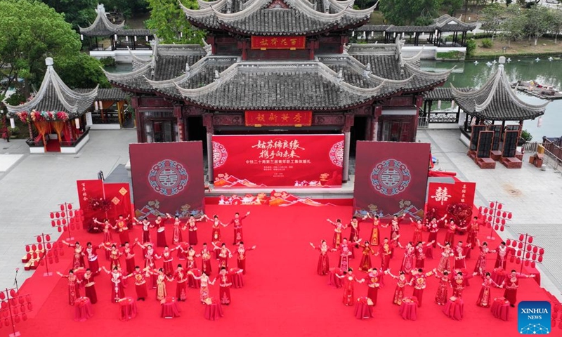 An aerial drone photo taken on Sept. 29, 2025 shows couples taking part in a group wedding in the Luzhi ancient town in Suzhou, east China's Jiangsu Province. Photo: Xinhua