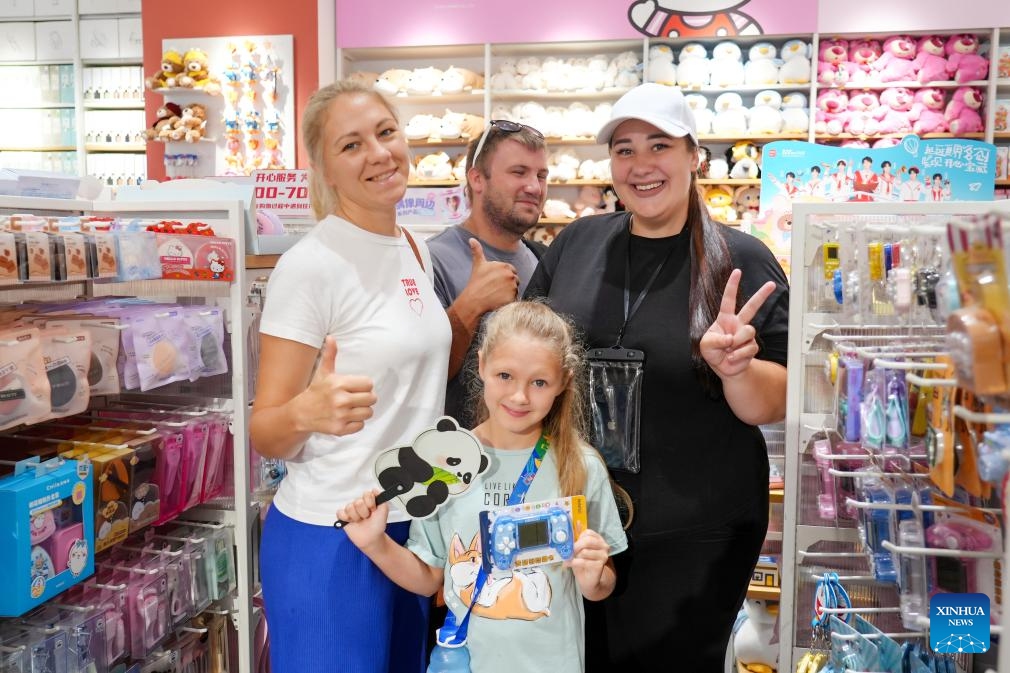 Russian tourists make purchases at a store in Hunchun, northeast China's Jilin Province, Sept. 29, 2025. 