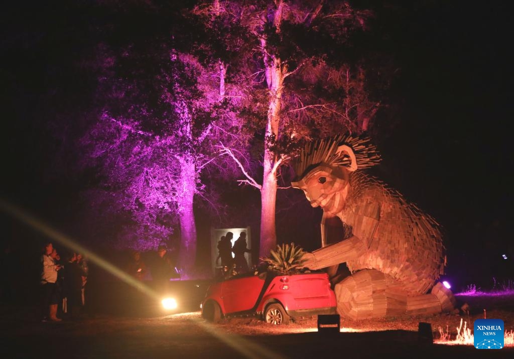 People view a gigantic statue during the Nightfall event at the Filoli Historic House & Garden in Woodside, California, the United States, Oct. 3, 2025. The second Nightfall opened here on Friday and will last till Nov. 10. (Photo by Liu Yilin/Xinhua)

