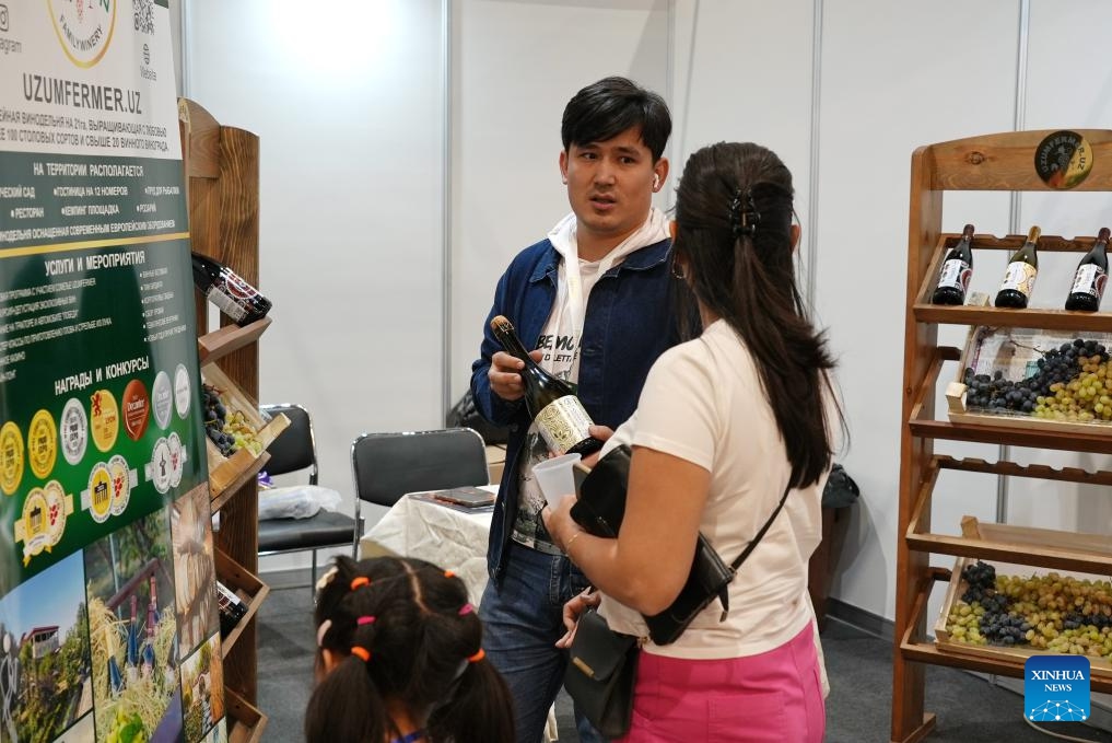 People visit an international exhibition of food, packaging, processing technologies and HoReCa (hotel, restaurant and cafe) industry in Tashkent, the capital of Uzbekistan, on Oct. 4, 2025. The exhibition, held here on Oct. 2-4, brought together companies from various sectors, including food, ingredients and spices, packaging equipment, hygiene and safety, and storage and logistics, aiming to promote technological exchange within the industry and drive the development of the sector in Uzbekistan. (Photo by Zafar Khalilov/Xinhua)