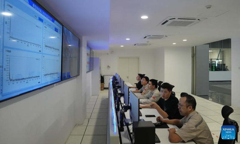 Staff members manage the operation of the centrifuge coded CHIEF1300 via a safety monitoring system in Hangzhou, east China's Zhejiang Province, on Sept. 29, 2025. Photo: Xinhua
