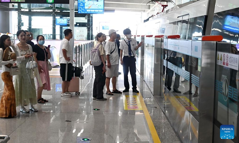 Passengers wait for the airport-bound train at a station of Fuzhou Metro Binhai Express in Fuzhou, southeast China's Fujian Province, Sept. 29, 2025. With a length of about 62.4 kilometers, Fuzhou Metro Binhai Express became operational on Monday. Photo: Xinhua