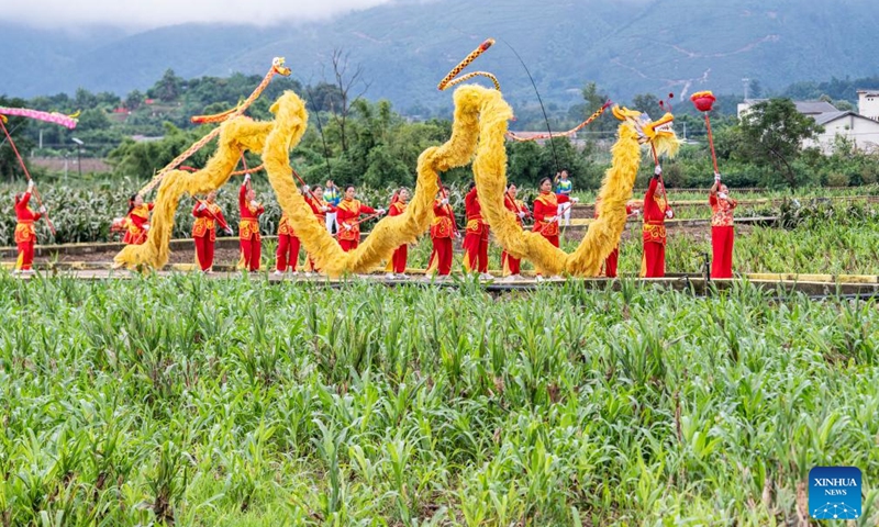 Villagers perform a dragon dance in Jiangjun Village, Bishan District, southwest China's Chongqing Municipality, Sept. 29, 2025. Photo: Xinhua
