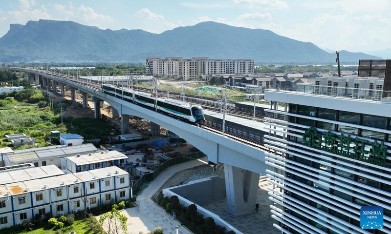 An aerial drone photo taken on Sept. 29, 2025 shows a train entering a station of Fuzhou Metro Binhai Express in Fuzhou, southeast China's Fujian Province. With a length of about 62.4 kilometers, Fuzhou Metro Binhai Express became operational on Monday. Photo: Xinhua