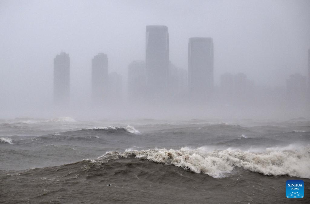 This photo taken on Oct. 5, 2025 shows rainfall and waves on waters near downtown area of Haikou, south China's Hainan Province. Typhoon Matmo, the 21st named storm of the 2025 Pacific typhoon season, is intensifying as it nears south China's coastal areas, leading to large-scale evacuations.