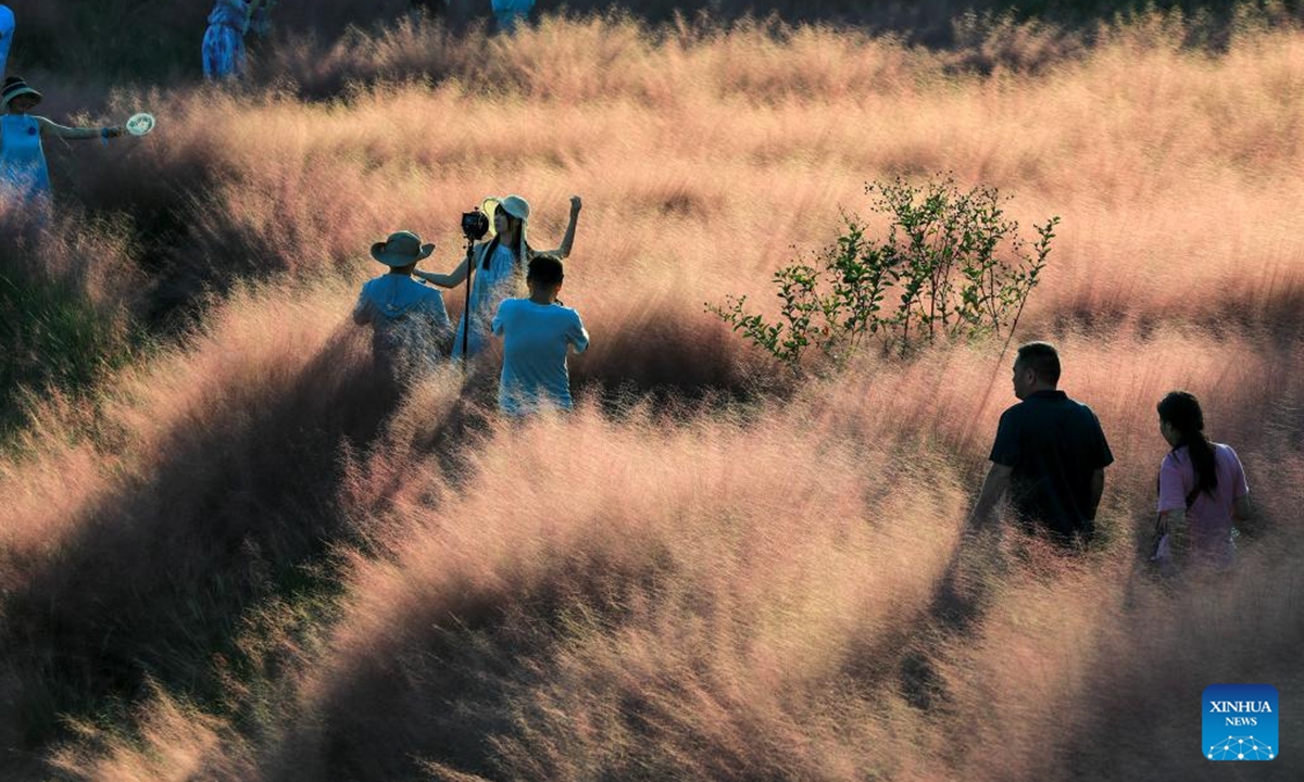 Tourists enjoy themselves at the Wenling Botanical Garden in Taizhou, east China's Zhejiang Province, Oct. 2, 2025. With China's Mid-Autumn Festival falling alongside National Day this year, people spend their leisure time through various ways during the eight-day holiday. (Photo by Zhou Xuejun/Xinhua)

