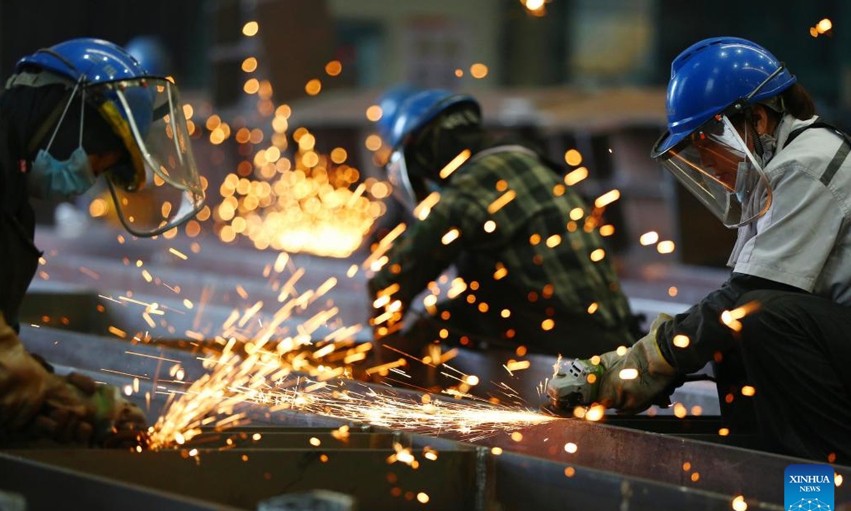 Workers grind steel components at a workshop in Tengzhou City, east China's Shandong Province, Oct. 2, 2025. Workers from all walks of life have been standing fast at their posts and fulfilling their duties with full dedication during the eight-day National Day and Mid-Autumn Festival holiday. (Photo by Li Zhijun/Xinhua)  