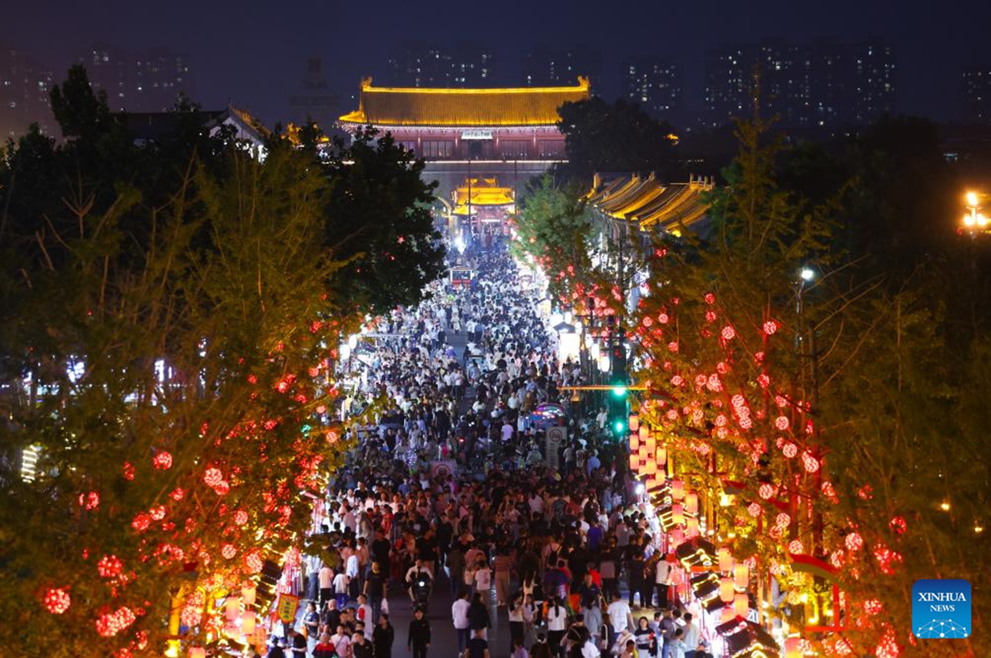 Tourists are seen at the Zhengding ancient city in Shijiazhuang, north China's Hebei Province, Oct. 1, 2025. Tourist destinations across China are witnessing a surge in visitors as the country's eight-day National Day and Mid-Autumn Festival holiday began on Wednesday. (Photo by Liang Zidong/Xinhua)


