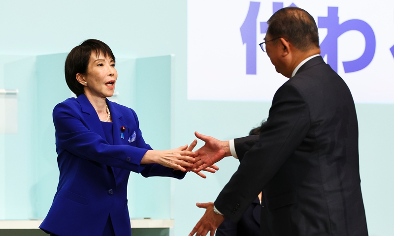 Newly-elected leader of Japan's Liberal Democratic Party (LDP) Sanae Takaichi (left), shakes hands with Prime Minister Shigeru Ishiba after winning the LDP leadership election in Tokyo, Japan, on October 4, 2025. Photo: CFP