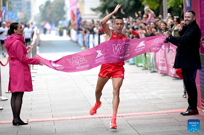 Dario Ivanovski of North Macedonia crosses the finish line during Skopje Marathon in Skopje, North Macedonia, Oct. 5, 2025. Photo: Xinhua