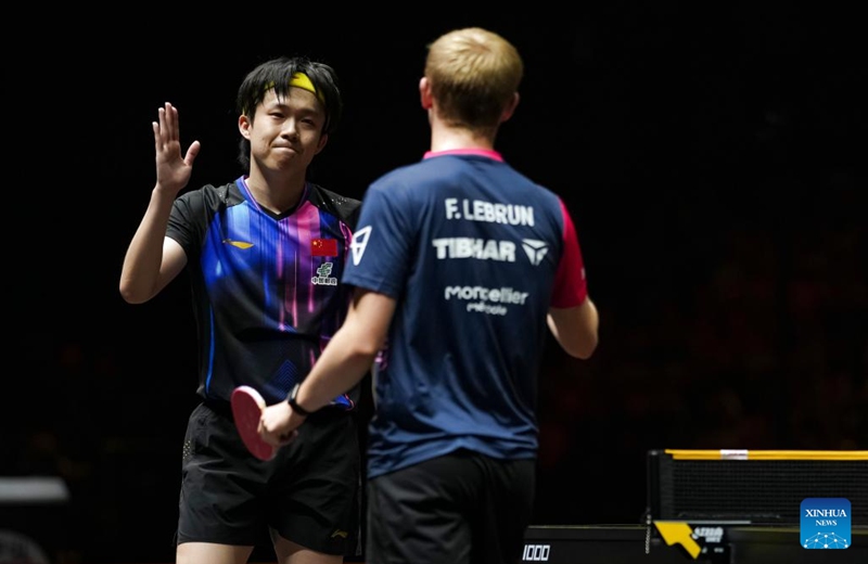 Wang Chuqin (L) greets Felix Lebrun after the men's singles final match between Felix Lebrun of France and Wang Chuqin of China at 2025 World Table Tennis (WTT) China Smash in Beijing, China, Oct. 5, 2025. (Xinhua/Sun Fei)