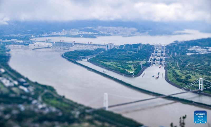 This photo taken on Oct. 4, 2025 with a tilt-shift lens shows a view of the Three Gorges Dam and its ship lock in Yichang of central China's Hubei Province. (Xinhua/Chen Yehua)