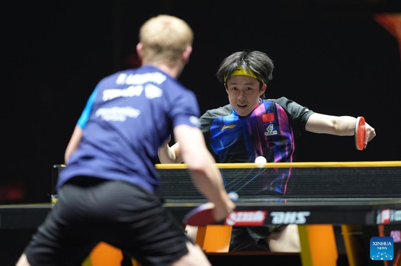 Wang Chuqin (R) of China hits a return during the men's singles final match between Felix Lebrun of France and Wang Chuqin of China at 2025 World Table Tennis (WTT) China Smash in Beijing, China, Oct. 5, 2025. (Xinhua/Xie Han)