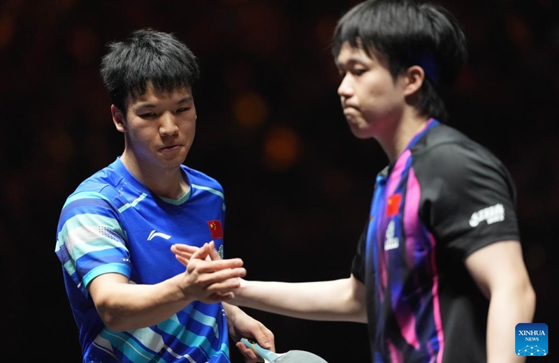 Xiang Peng (L) and Wang Chuqin of China shake hands after their men's singles semifinal match at 2025 World Table Tennis (WTT) China Smash in Beijing, China, Oct. 5, 2025. (Xinhua/Xie Han)