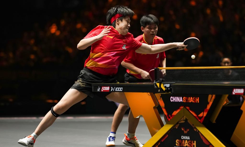 Lin Shidong/Wang Chuqin (L) of China compete during the men's doubles final match against Zhou Qihao/Chen Junsong of China at 2025 World Table Tennis (WTT) China Smash in Beijing, China, Oct. 4, 2025. (Xinhua/Sun Fei)