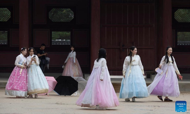 People in traditional Korean attire Hanbok visit the Gyeongbokgung Palace in Seoul, South Korea, Oct. 5, 2025. Ancient palaces in Seoul including the Gyeongbokgung Palace are open to the public free of charge from Oct. 3 to 9. (Photo by Jun Hyosang/Xinhua)