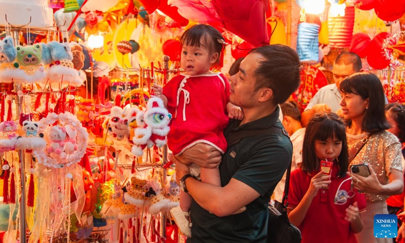People shop for the Mid-Autumn Festival at Hang Ma Street in Hanoi, Vietnam, Oct. 3, 2025. Hanoi's Hang Ma Street is brightly decorated with lanterns and festive items for the upcoming Mid-Autumn Festival. (Photo by Dang Hong Dung/Xinhua)