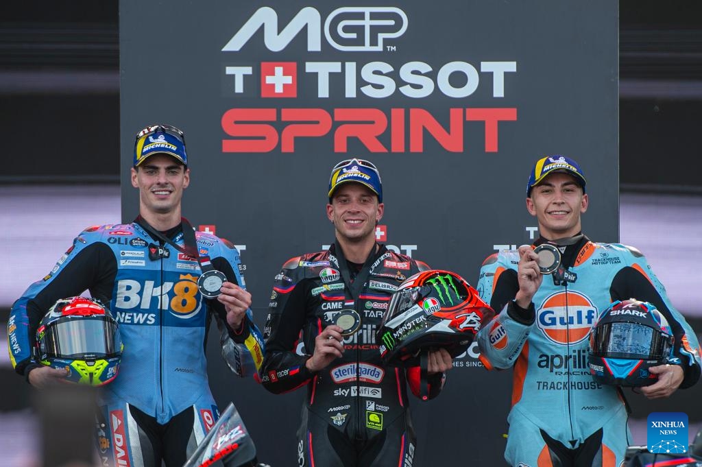 Gold medalist Italian rider Marco Bezzecchi (C) of Aprilia Racing, silver medalist Spainish rider Fermin Aldeguer (L) of Gresini Racing MotoGP and bronze medalist Spainish rider Raul Fernandez of Trackhouse MotoGP pose on the podium during the awarding ceremony of the Sprint Race of MotoGP at the Pertamina Grand Prix of Indonesia 2025 in Lombok Island, Indonesia on Oct. 4, 2025. Photo: Xinhua