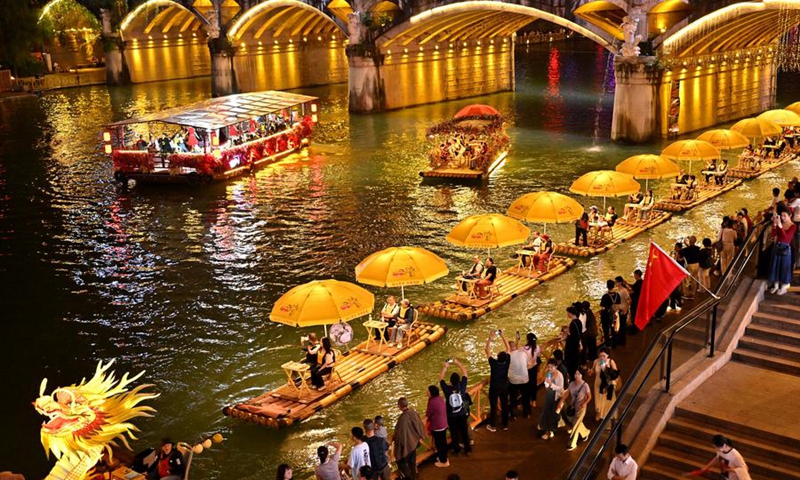 Tourists take bamboo rafts at a scenic area in Xuan'en County, Enshi Tujia and Miao Autonomous Prefecture, central China's Hubei Province, Oct. 3, 2025. Tourist destinations across China are witnessing a surge in visitors as the country's eight-day National Day and Mid-Autumn Festival holiday began on Wednesday. (Photo by Song Wen/Xinhua)