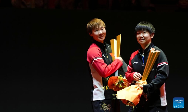 Winner Wang Manyu (L) and runner-up Sun Yingsha of China pose during the awarding ceremony for the women's singles event at 2025 World Table Tennis (WTT) China Smash in Beijing, China, Oct. 5, 2025. (Xinhua/Sun Fei)