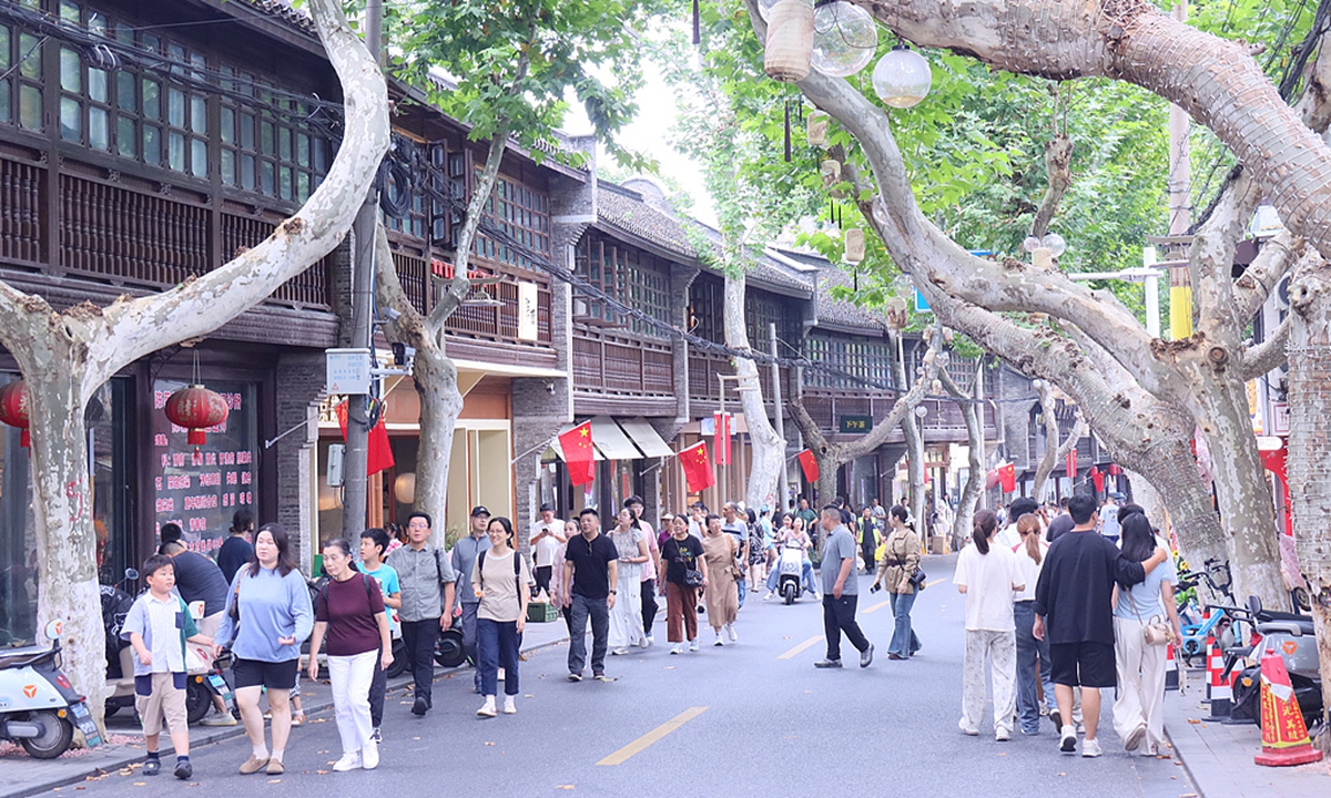 Tourists visit the trendy ancient street Jingji Road in Zhenjiang, East China's Jiangsu Province, on October 4, 2025. Photo: VCG