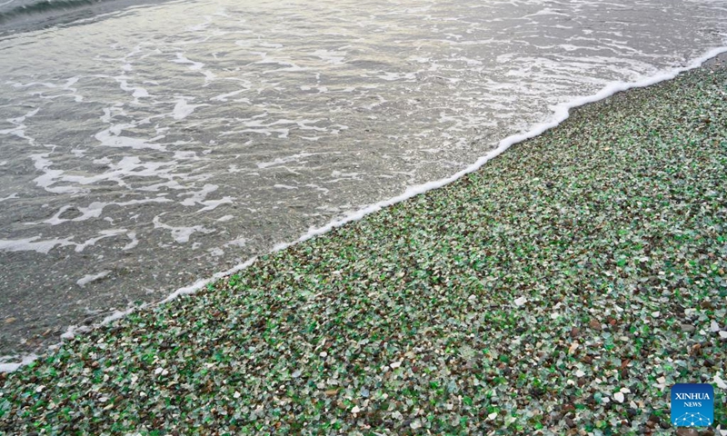 This photo taken on Oct. 5, 2025 shows a view of Glass Beach in Vladivostok, Russia. Located in Ussuri Bay on the outskirts of Vladivostok, Glass Beach was once a dumping site for discarded glassware. After decades of being washed by the sea, the glass fragments have been polished into smooth, colorful pebbles, creating a vibrant shoreline that attracts large number of tourists. (Photo by Guo Feizhou/Xinhua)