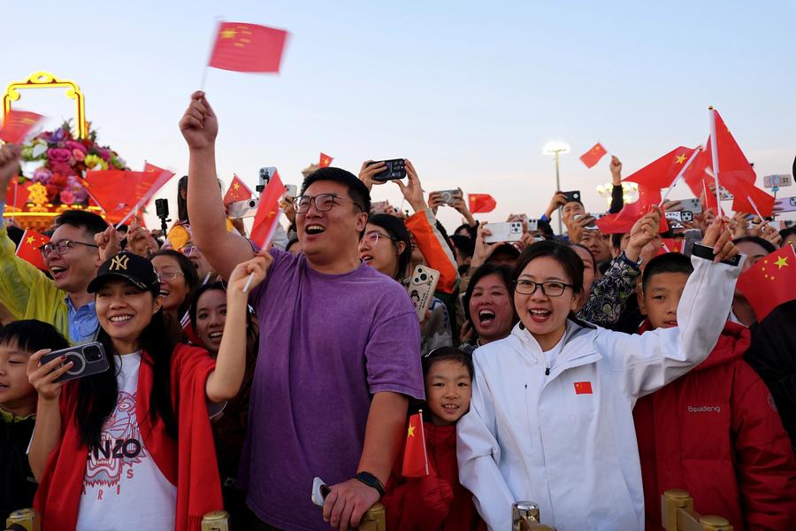 People attend a flag-raising ceremony marking the 76th anniversary of the founding of the People's Republic of China at Tian'anmen Square in Beijing, capital of China, Oct. 1, 2025. (Xinhua/Xing Guangli)