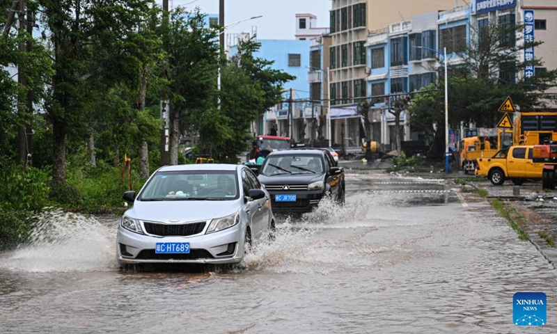 Motor vehicles plough through a flooded street in Wenchang, south China's Hainan Province, Oct. 5, 2025. Typhoon Matmo, the 21st named storm of the 2025 Pacific typhoon season, made landfall along the eastern coast of Xuwen County, Zhanjiang City in south China's Guangdong Province around 2:50 p.m. on Sunday, according to Guangdong's meteorological service.

Heavily affected by Matmo, many parts of Hainan Island, which sits to the south of Guangdong, still suffer from strong wind and rainfall late on Sunday. Photo: Xinhua