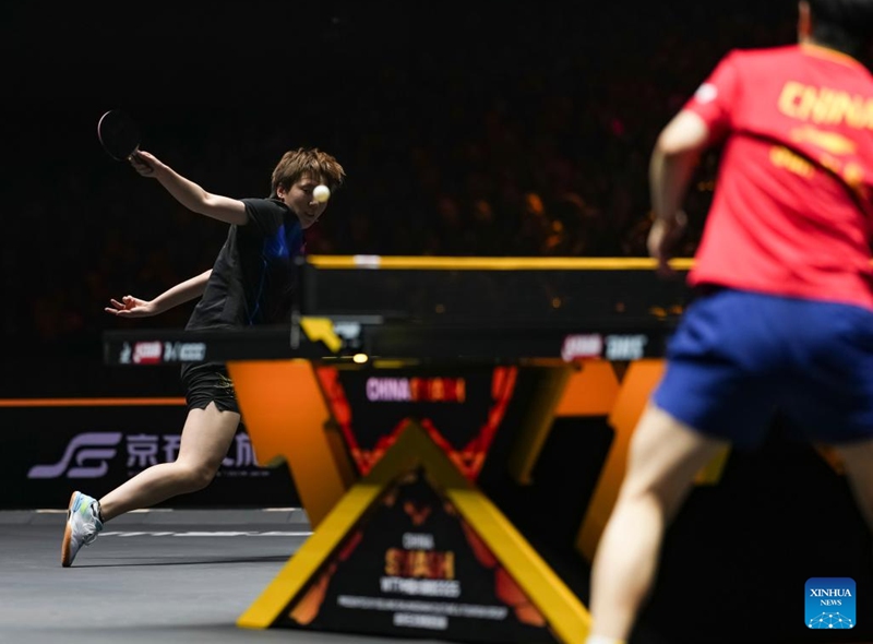 Wang Manyu of China hits a return during the women's singles final match between Sun Yingsha of China and Wang Manyu of China at 2025 World Table Tennis (WTT) China Smash in Beijing, China, Oct. 5, 2025. (Xinhua/Sun Fei)