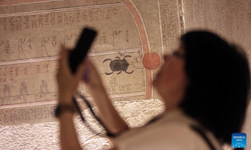 A tourist takes photos while visiting the tomb of New Kingdom Pharaoh Amenhotep III in the Valley of the Kings on the West Bank of Luxor, Egypt, on Oct. 4, 2025. Egypt's Ministry of Tourism and Antiquities on Saturday opened the tomb of New Kingdom Pharaoh Amenhotep III in the Valley of the Kings to visitors, following more than two decades of restoration.

The tomb, belonging to Amenhotep III who ruled Egypt more than 3,500 years ago, is situated on the western side of the famed necropolis. Egyptian antiquities authorities said it was first discovered in 1799 and subsequently looted, including the sarcophagus. Photo: Xinhua