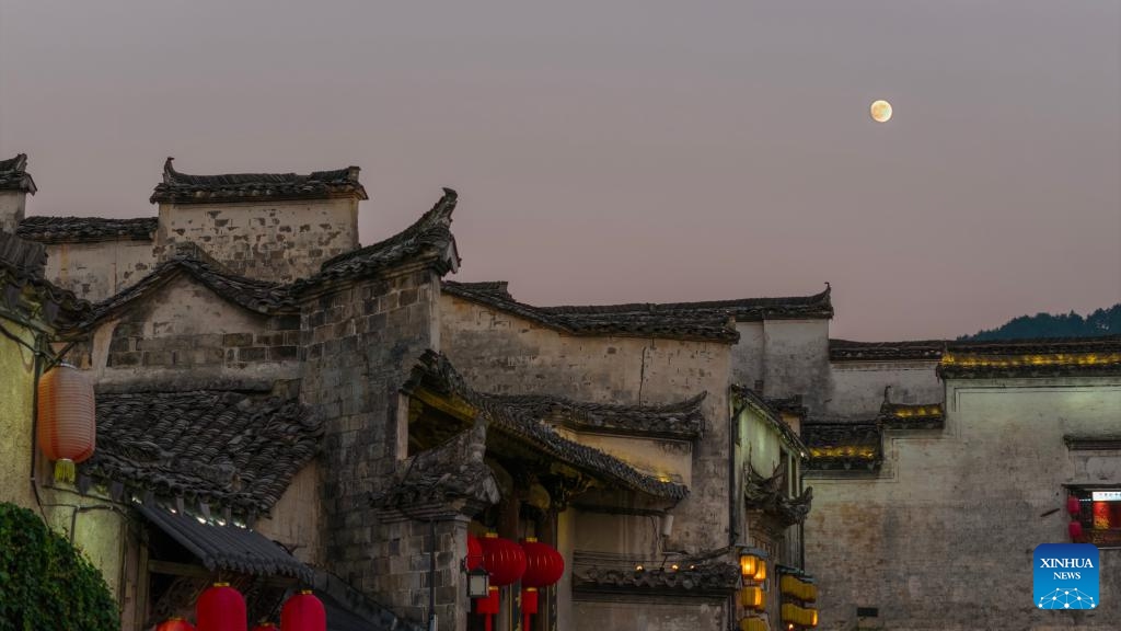 This aerial drone photo taken on Oct. 5, 2025 shows the moon at Hongcun Village of Yixian County, Huangshan City, east China's Anhui Province. Yixian County is noted for its lantern gala, an important folk event held during traditional festivals. (Photo by Wang Cheng/Xinhua)