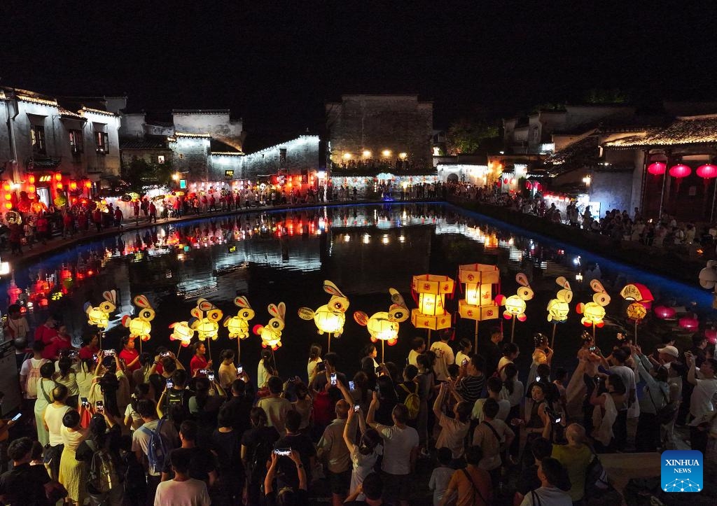 This aerial drone photo taken on Oct. 5, 2025 shows people taking part in a lantern parade at Hongcun Village of Yixian County, Huangshan City, east China's Anhui Province. Yixian County is noted for its lantern gala, an important folk event held during traditional festivals. (Photo by Shi Yalei/Xinhua)